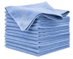 A stack of blue cloths used for auto detailing on a white background.