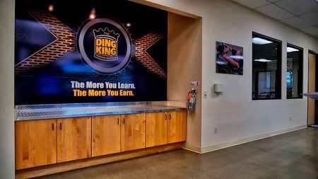 A PDR training facility showcasing a spacious lobby adorned with a prominent wall sign.