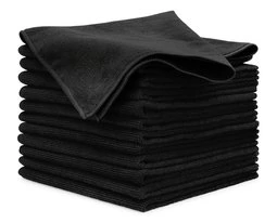 A stack of black microfiber cloths for auto detailing on a white background.