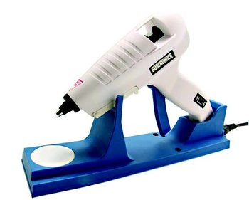 A white glue gun on a blue stand used for paintless dent repair.